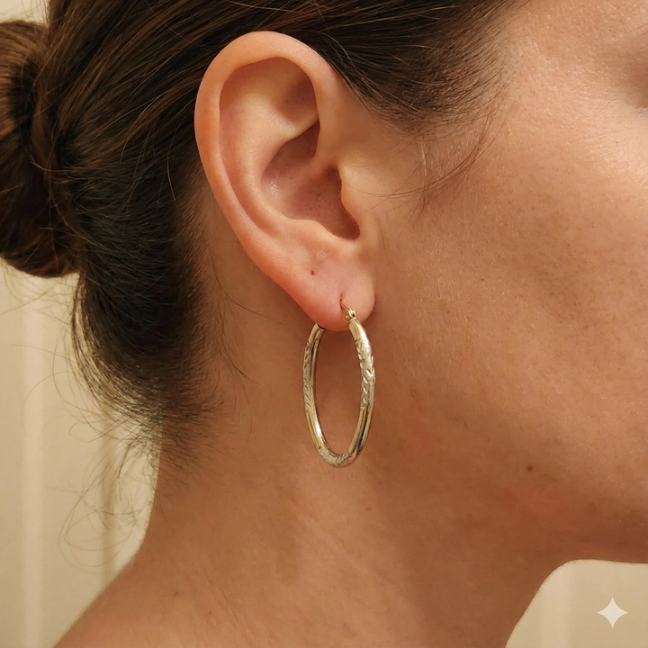 Gold Elongated Hoop Diamond Cut Earrings