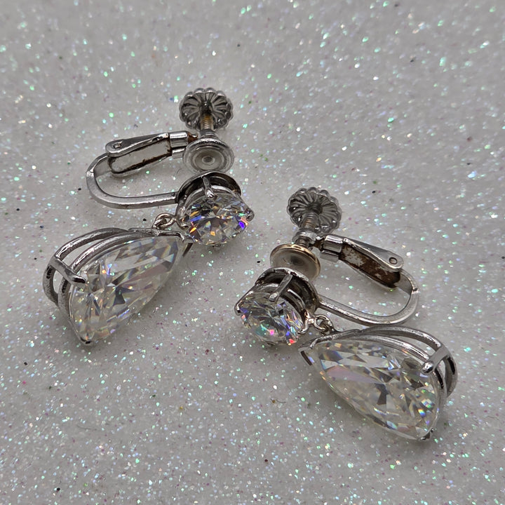 Pair of white gold dangle earrings with clear gemstone quartz