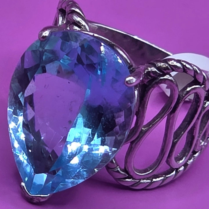 Silver ring with a blue teardrop-shaped topaz