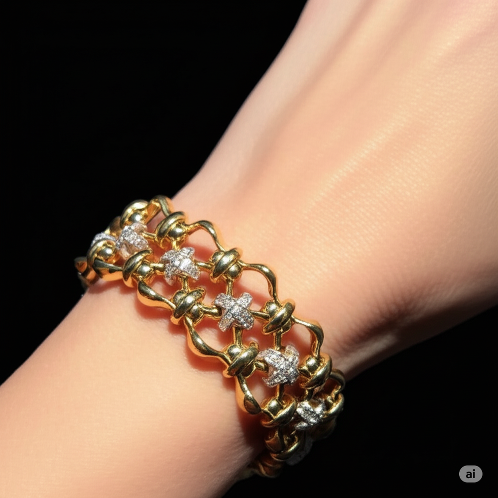 Gold bracelet with star-shaped stones on a wrist against a black background