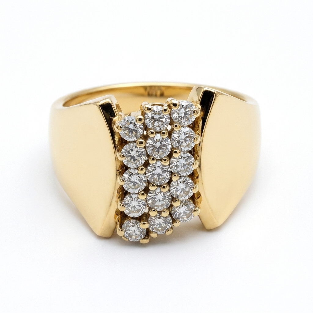 Gold ring with diamond accents on a soft pink fabric background